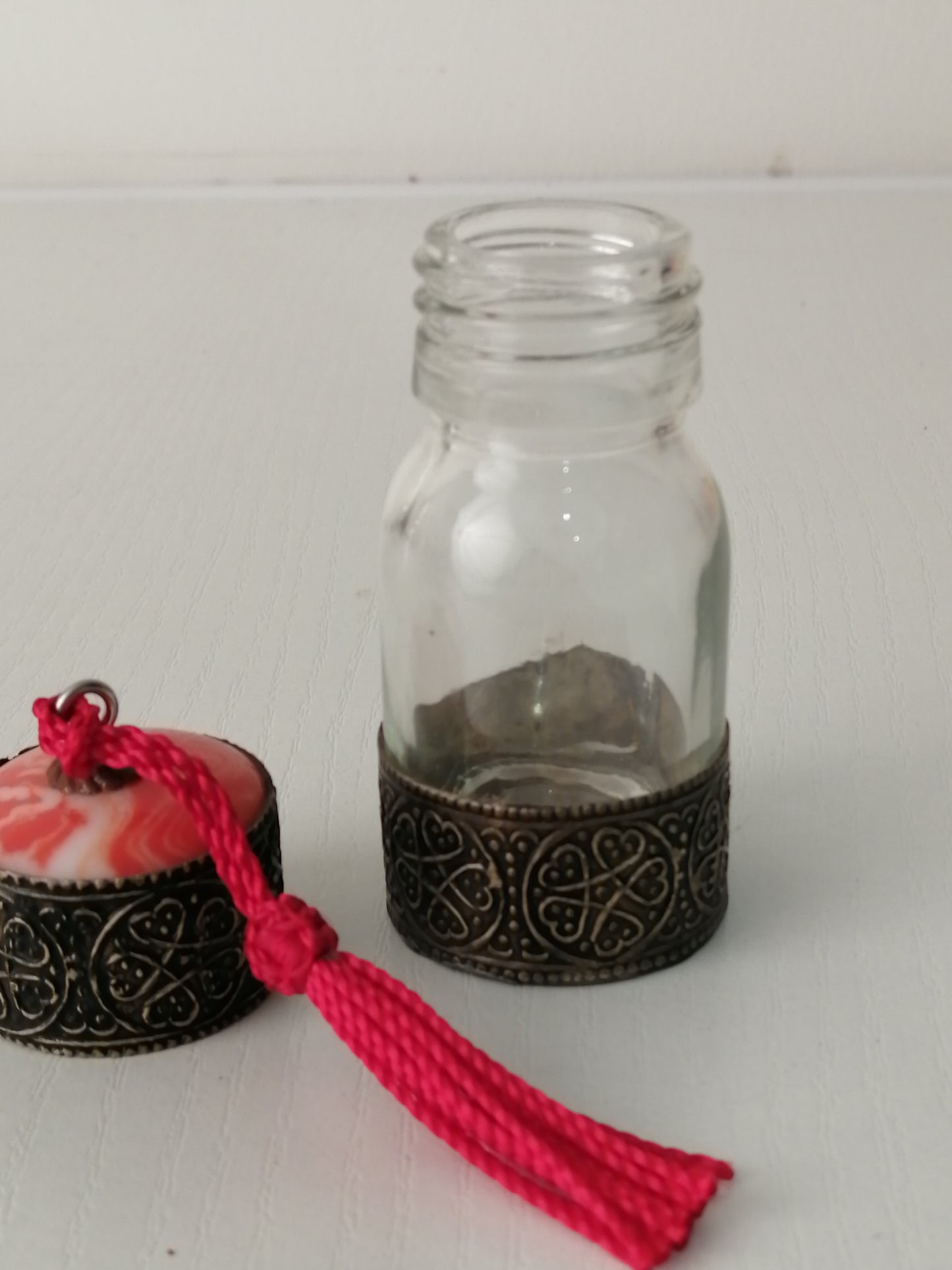 Clear glass and brass bottle