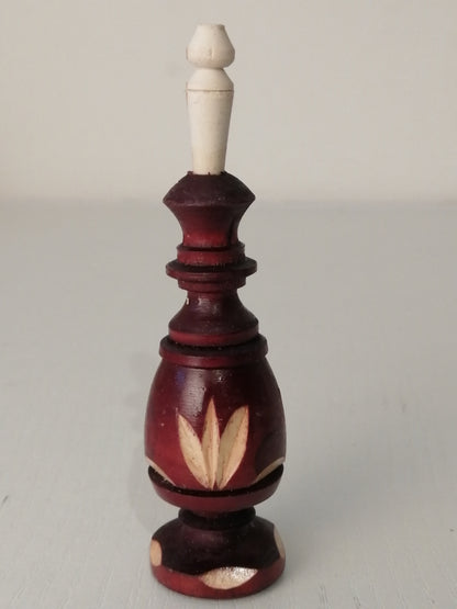 Brown carved kohl bottle