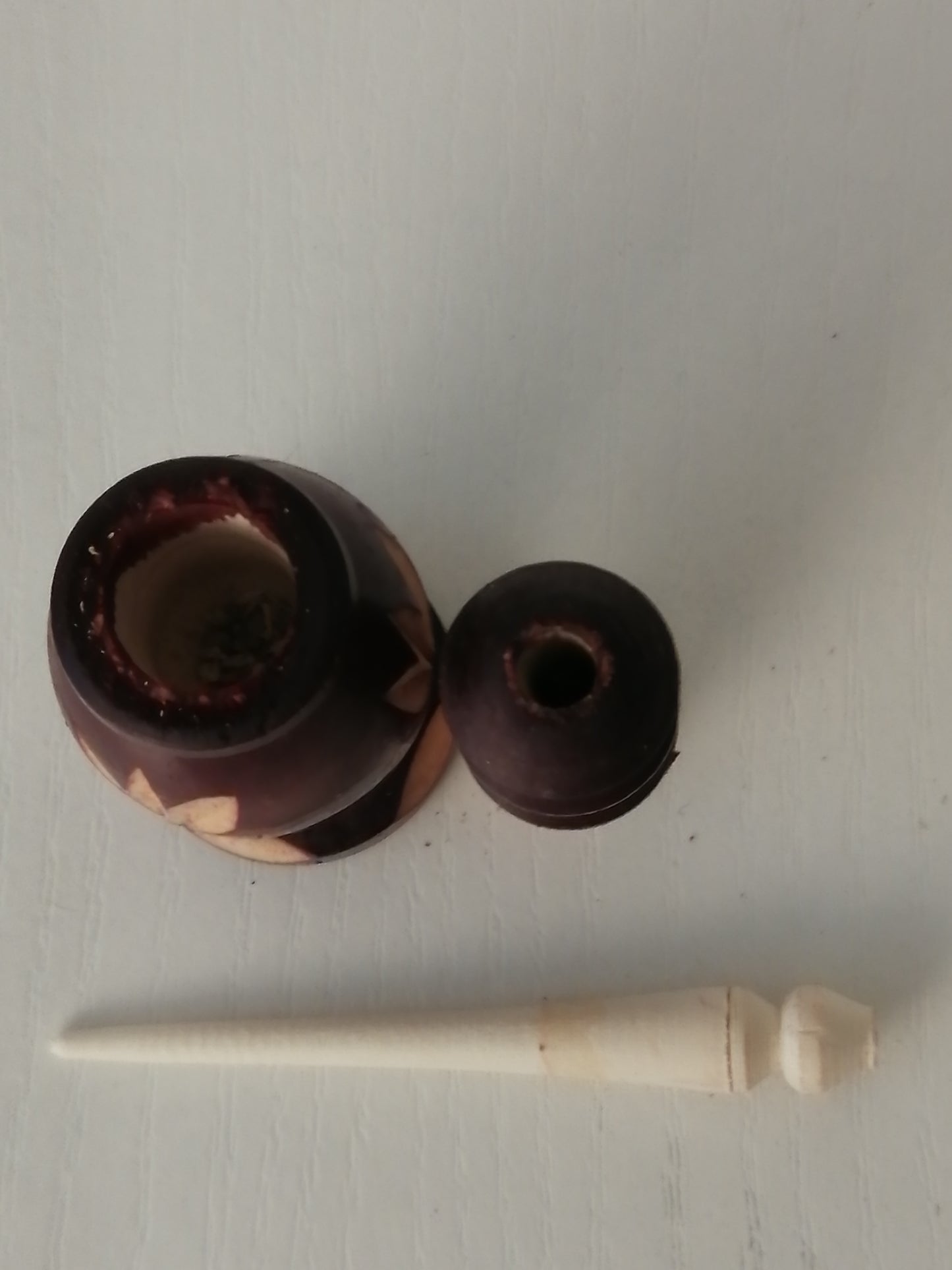 Brown carved kohl bottle