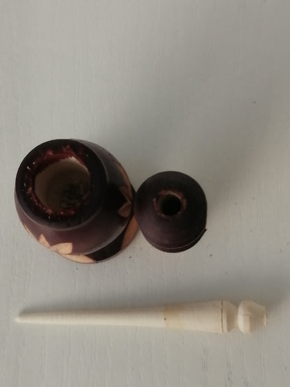 Brown carved kohl bottle